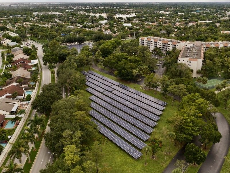 A housing society with a rooftop solar panel system imstalled at a large scale.